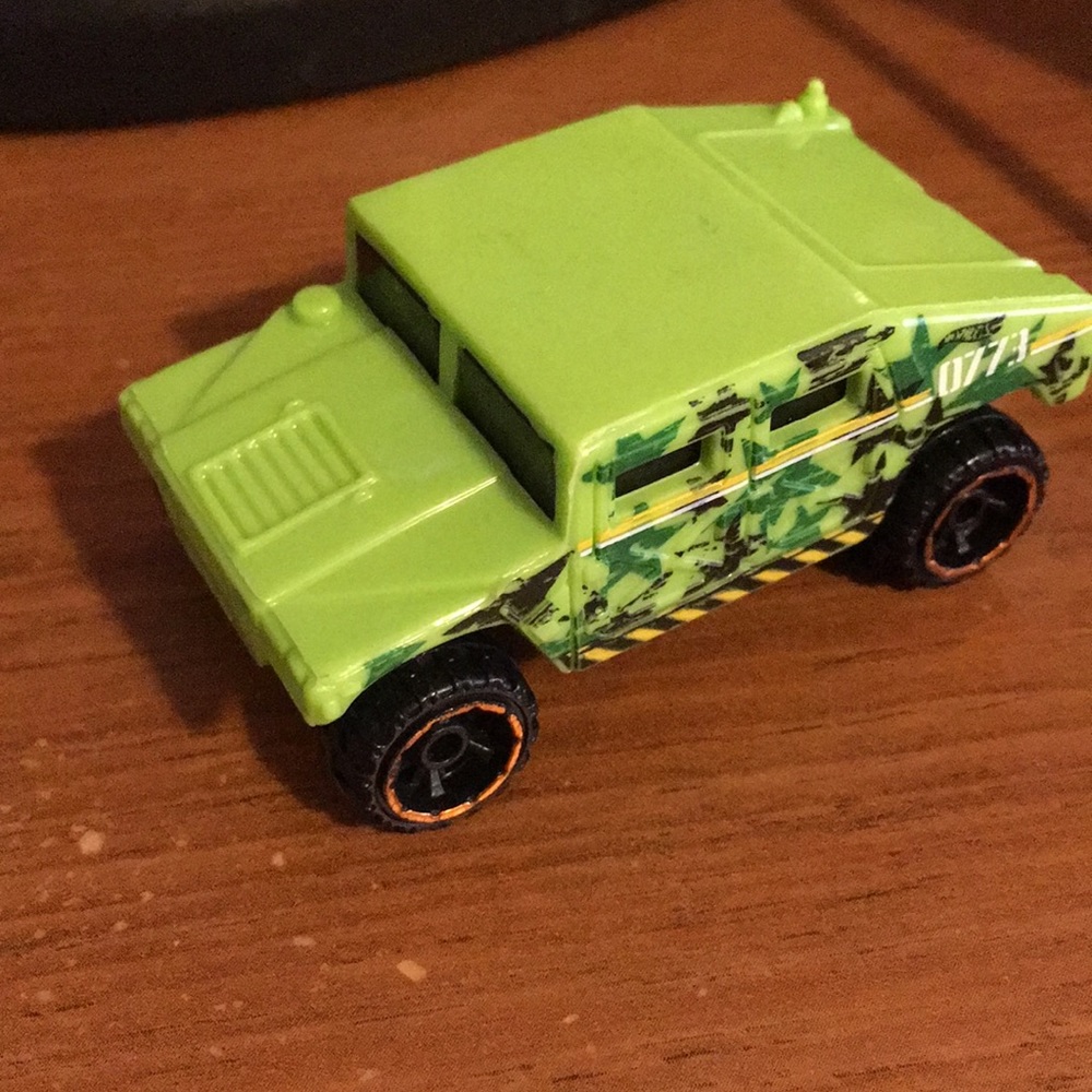 Hot wheels army vehicle green and yellow and black